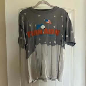 Buttery soft vintage FARM AID IV T-shirt with bleached out detail.